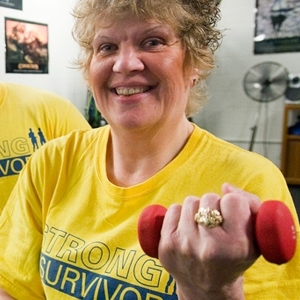 SIU Strong Survivor doing bicep curls